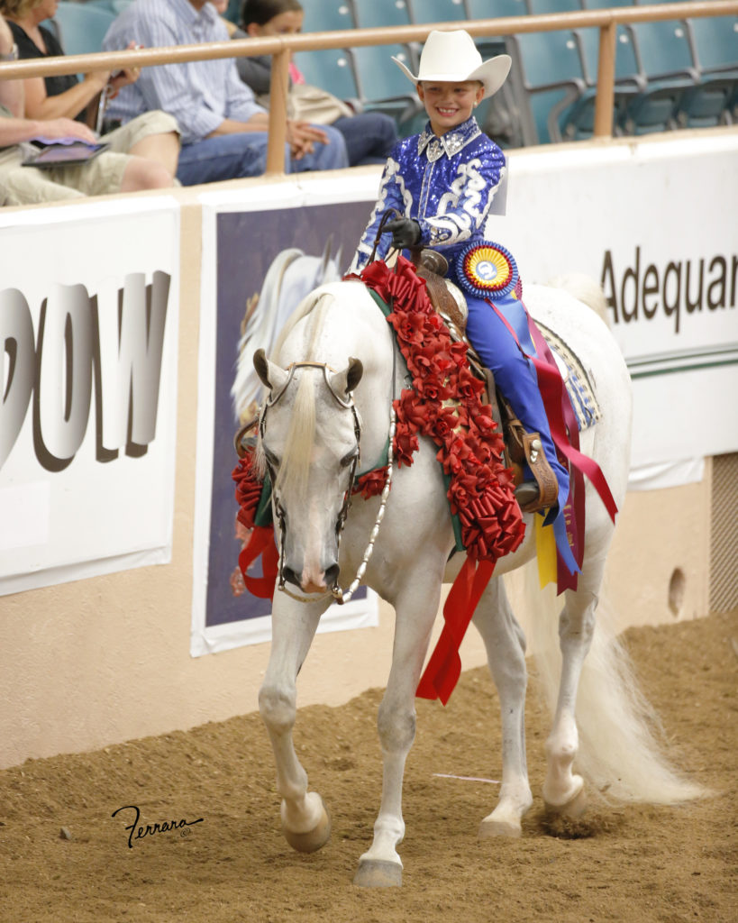 Brinley winning Western Seat Equtaion on Dylan SA at youth '13